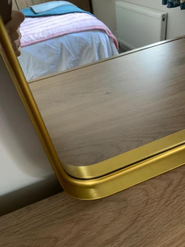 Gold mirror frame detail