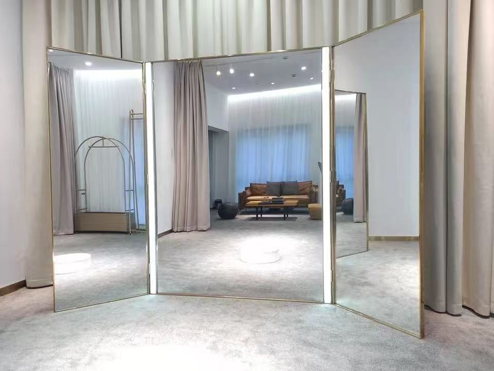 Multi-panel statement mirror display in a dressing room